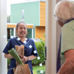 caregiver delivering groceries