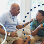 senior with dementia talking to son