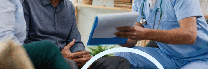 Doctor discussing health plan with senior patient during consultation.